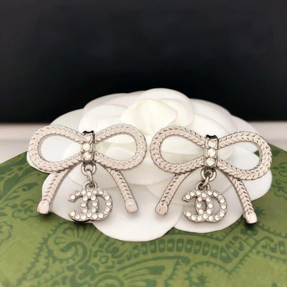 GOLDURA® DOUBLE C BOW EARRINGS