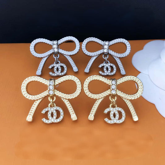 GOLDURA® DOUBLE C BOW EARRINGS