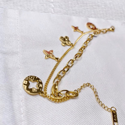 FOUR LEAF CLOVER CHARMS BRACELET - GOLD AND SILVER