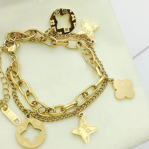 FOUR LEAF CLOVER CHARMS BRACELET - GOLD AND SILVER